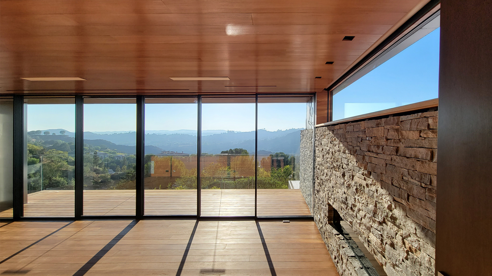 Paolo-Volpis-Architect-hillside-house-modern-minimalist-stone-marble-black-kitchen-wood-slats-teak-glass-mid-century-modern-pool-with-poliform-boffi copy.jpg